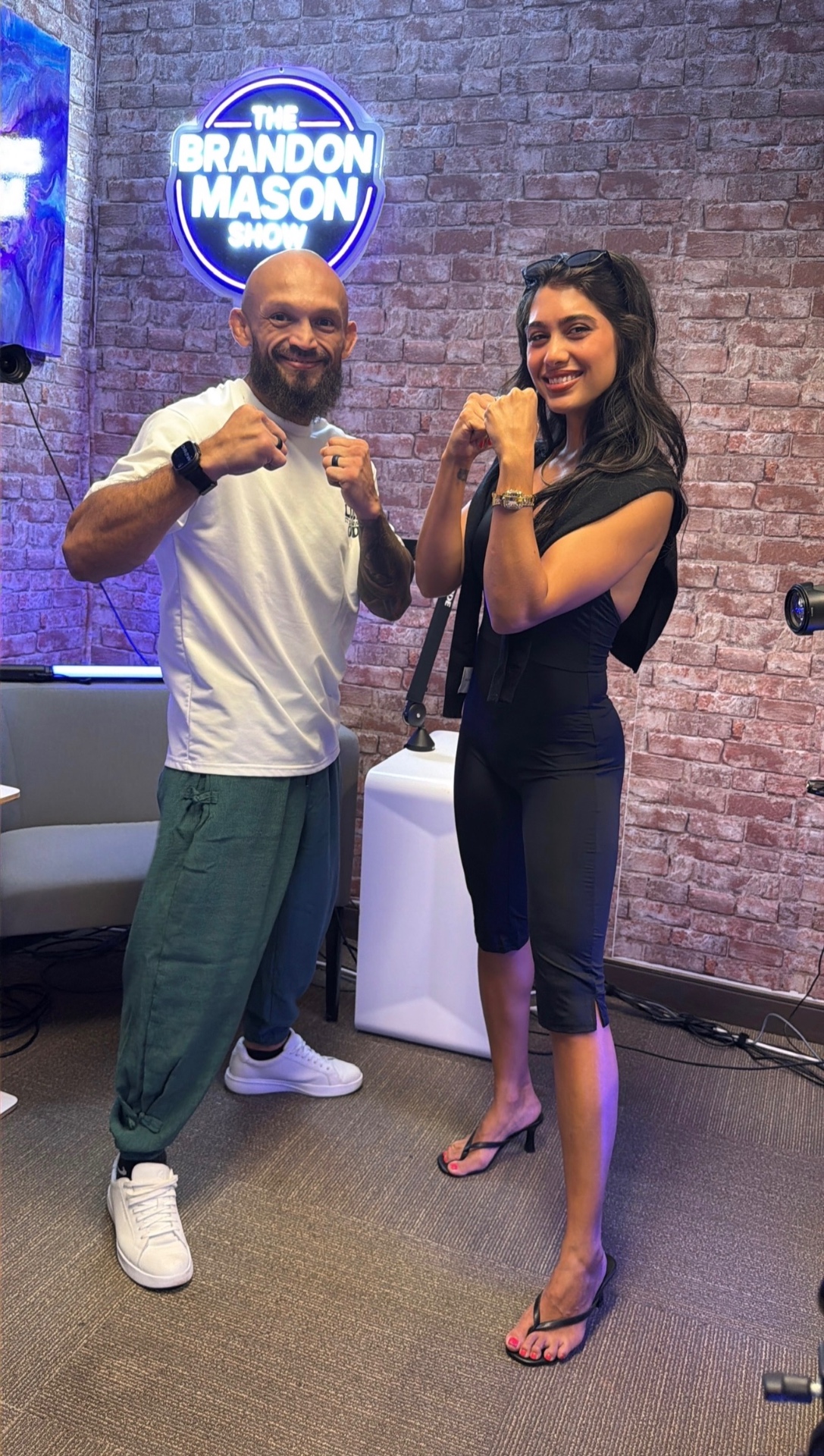 Edgard Plazaola with Brittany Mason inside The Brandon Mason Show studio in Brickell Miami.